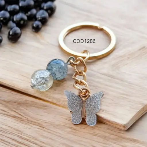 Llavero de mariposa esmaltado con perlas