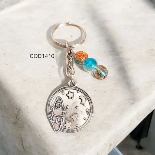 Llavero de cohete con estrellas, circular.