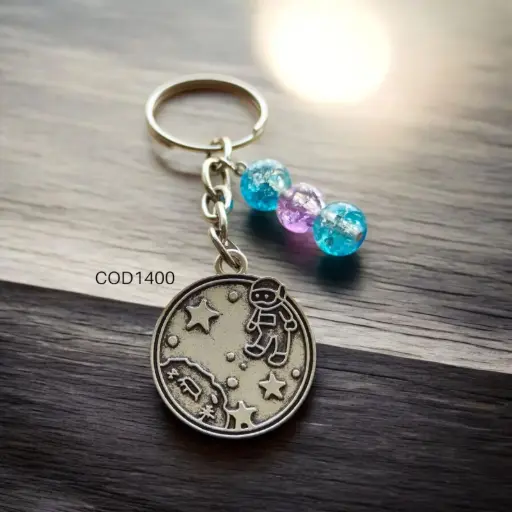Llavero de astronauta con estrellas, circular.