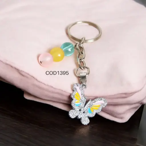 Llavero de mariposa rosada con perlas multicolor