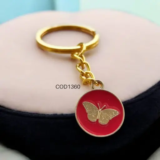 Llavero circular rojo con mariposa dorada